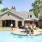 Residents sitting on  the edge of Rock Springs Village's community pool