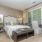 Well-lit primary bedroom 