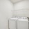 Townhome laundry room with a washer and dryer at Rock Springs Village