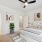 Primary bedroom with modern furnishings in a townhome at Rock Springs Village
